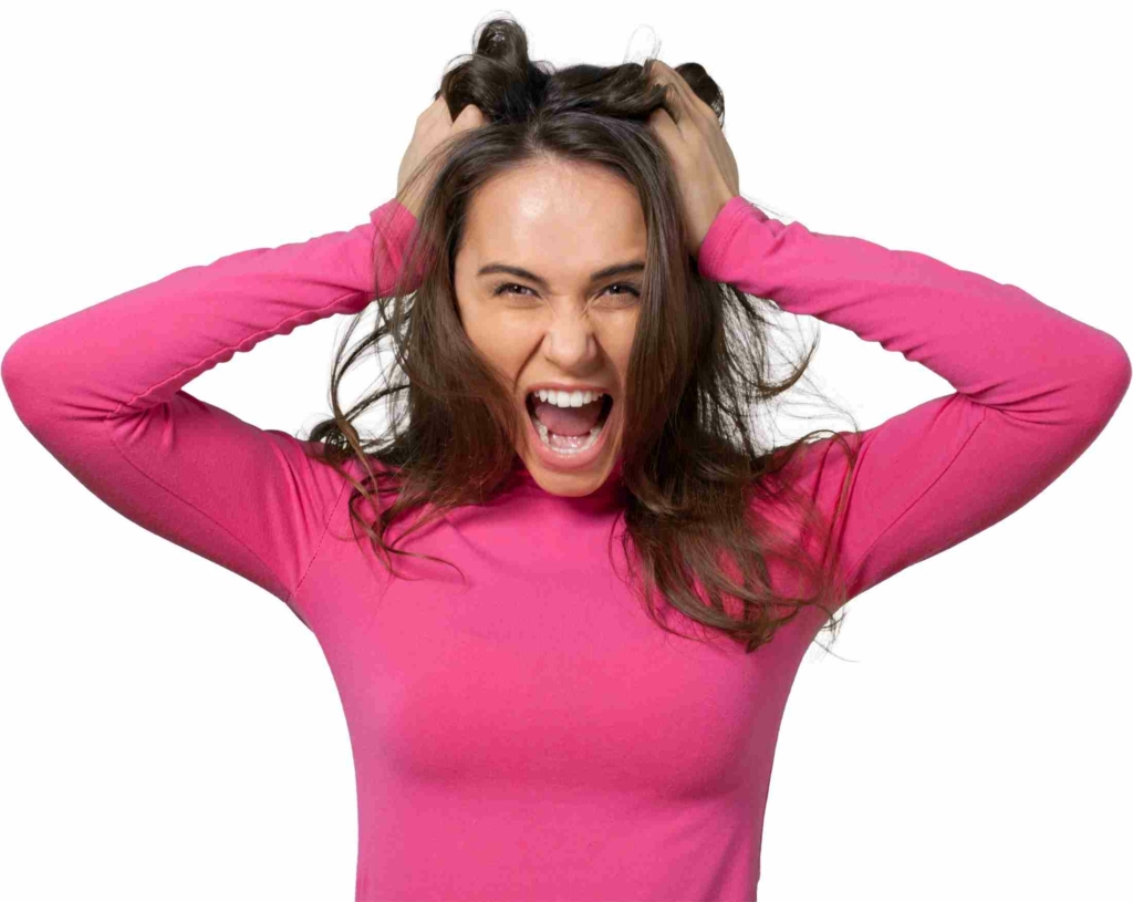 woman angry with hands in hair in frustration