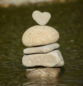 balanced rocks with heart shaped rock on top