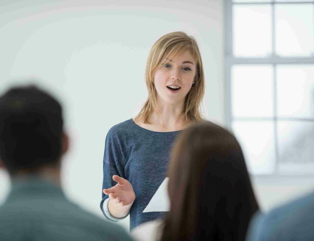 woman presenting to a group of colleagues