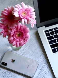 flowers next to laptop