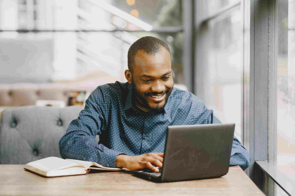 man using laptop for his online hypnosis session