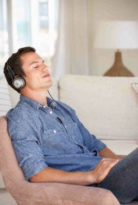 man receiving a virtual hypnosis session in the comfort of his own home