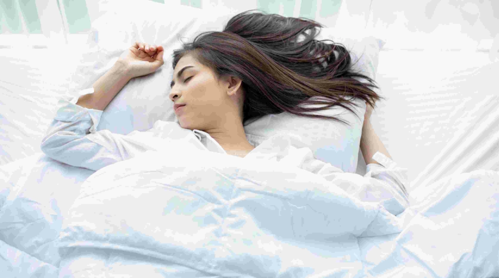 woman lying in bed sleeping peacefully