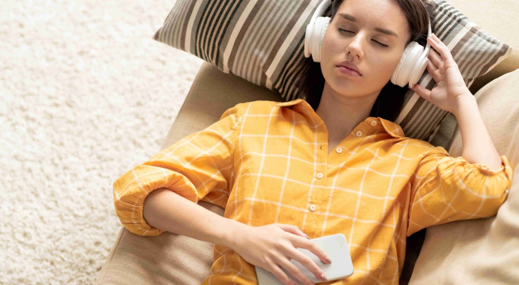 woman listening to guided meditation and hypnotherapy
